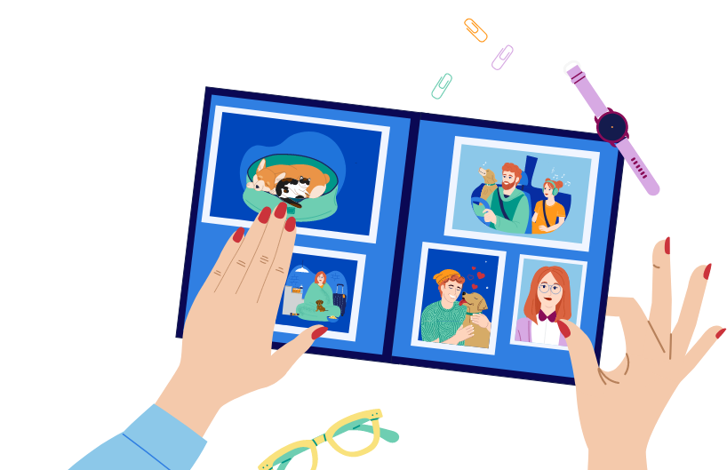 Hands holding an open scrapbook